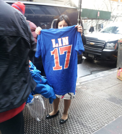 A woman looks at a Jeremy Lin jersey on the streets of New York City on February 17, 2012.