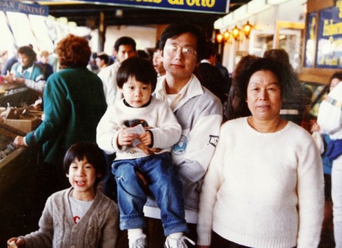 Jeremy Lin (2nd L) is pictured with his family in the United States in 1989. Photographs of NBA New York Knicks guard Lin in various places in the U.S. are displayed to reporters by Lin's grandmother Linchu A-mien in Changhwa county, central Taiwan, February 18, 2012.