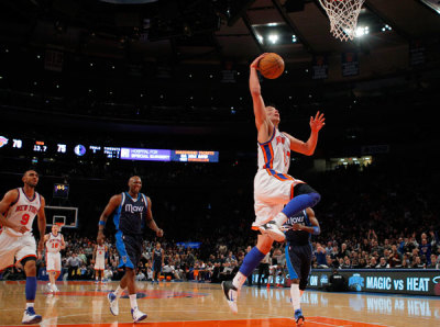 New York Knicks point guard Jeremy Lin drives to the basket against the Dallas Mavericks in the second half of their NBA basketball game at Madison Square Garden in New York, February 19, 2012.