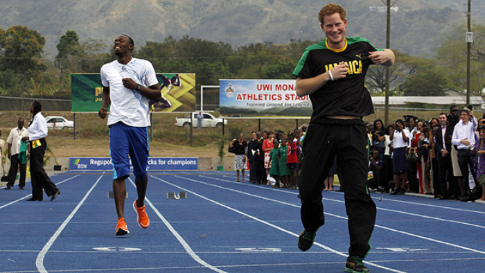 Prince Harry and Olympic gold medalist Usain Bolt run a race at the Usain Bolt track at the University of the West Indies in Jamaica March 6, 2012.
