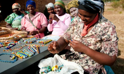 Women in South Africa receive training and supplies through World Vision to expand their craft making business.