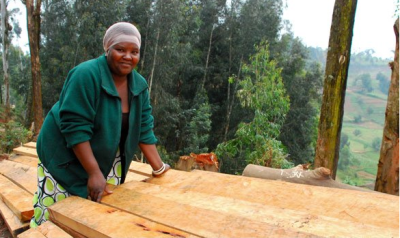 Marie Rose Mukarukundo was able to build her own timber and charcoal business in her native Rwanda thanks to a startup loan from Vision Finance.