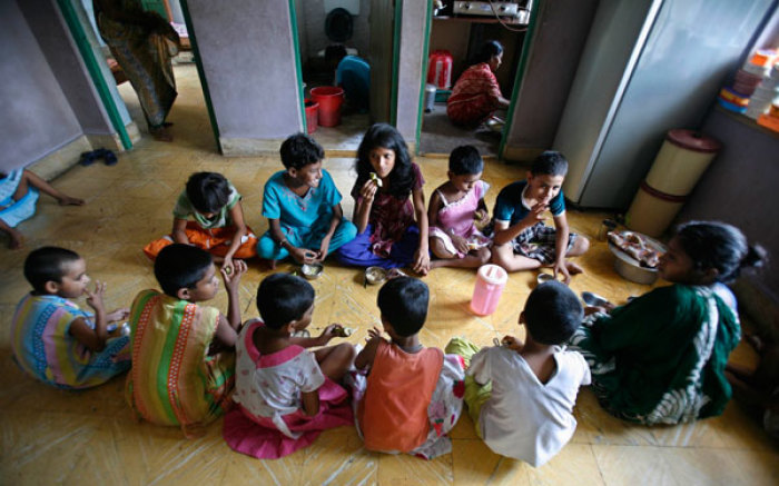 Children of sex workers eat in their room at Soma Home in the eastern Indian city of Kolkata July 14, 2007. The home, set up to protect young girls from being sexually abused or trafficked, is named after a girl who died due to lack of medical attention, programme coordinator Arnab Basu said.
