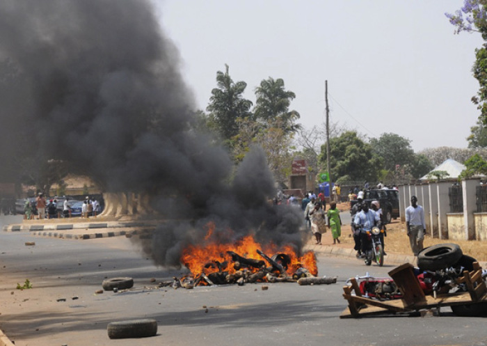 A roadblock burns after a bombing at St. Finbarr's Catholic Church in the Rayfield suburb of the Nigerian city of Jos March 11, 2012.
