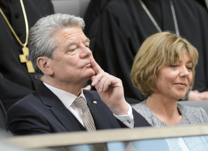 German presidential candidate Joachim Gauck and his partner Daniela Schadt listen during Germany's Federal Assembly in Berlin, March 18, 2012. Gauck is poised to become Germany's third president in just two years on Sunday after winning support from the country's main political parties, but the feisty theologian may prove an awkward partner for Chancellor Angela Merkel.