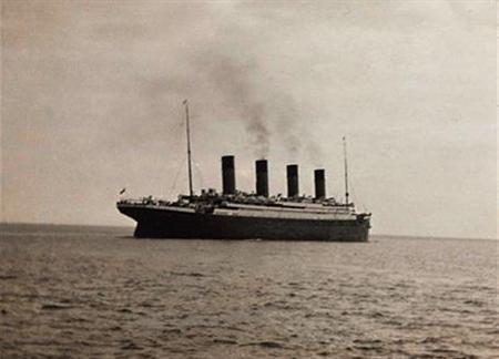 A photo of the Titanic, thought to be the last known image of the ship, as she sets sail from Queenstown for New York. The White Star liner, touted as "unsinkable," sank in 1912 with the loss of 1,523 lives.