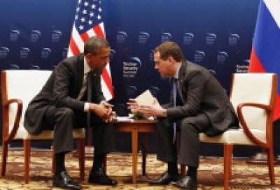 U.S. President Barack Obama speaking with Russian President Dmitry Medvedev at the Nuclear Security Summit in Seoul, South Korea, March 27, 2012.