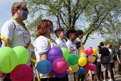Members of Soulforce stage a vigil outside of the campus of Oklahoma Baptist University in March 2012. According to Soulforce, each balloon represented a person of LGBTQ community, with their name and age, who have lost their lives because of bullying or hate crimes.