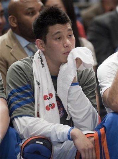 New York Knicks guards Jeremy Lin sits on the bench as they play the Indiana Pacers in the second quarter of their NBA basketball game at Madison Square Garden in New York in this March 16, 2012 file photograph.