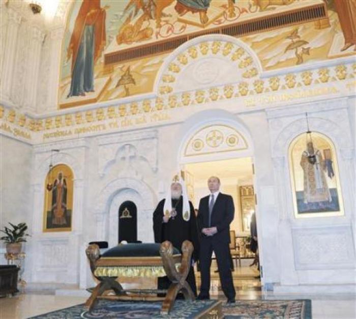 Russian Prime Minister Vladimir Putin (R) and Patriarch of Moscow and All Russia Kirill visit the restored rooms of Svyato-Danilov Monastery, the headquarters of the Russian Orthodox church, in Moscow February 1, 2012.