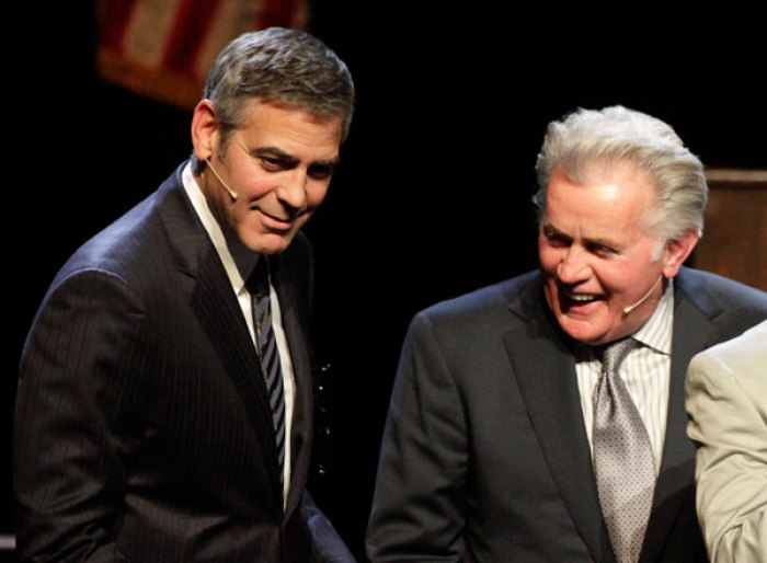 Actors George Clooney (L) and Martin Sheen stand onstage during the curtain call at the one night-production of '8' presented by The American Foundation For Equal Rights & Broadway Impact at The Wilshire Ebell Theatre in Los Angeles, California, March 3, 2012.