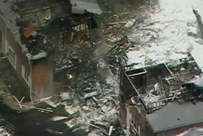 Firefighters work to control the blaze after the crash of an F-18 navy jet into an apartment building in Virginia Beach, pictured in this aerial frame grab from video on April 6 2012.