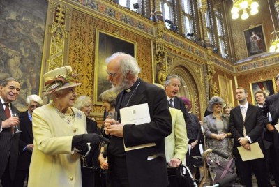 Britain's Queen Elizabeth II speaks with Rowan Williams, the Archbishop of Canterbury, during a reception at the Houses of Parliament in London on March 20, 2012.