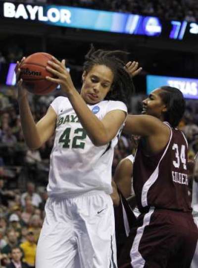 Baylor Lady Bears forward Brittney Griner (L) pulls in rebound against Texas A&M Aggies center Karla Gilbert in the first half of their NCAA Women's Dallas Regional college basketball game in Texas March 29 , 2011.