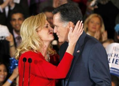 Mitt Romney gets a kiss from his wife Ann after she introduced him to speak to supporters at his Michigan primary night rally in Novi, Michigan, February 28, 2012.