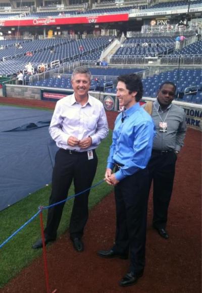 Pastor Joel Osteen stands with Houston Astros General Manager Jeff Luhnow as he prepares to throw the first pitch for the Washington Nationals April 16, 2012 in Washington, D.C.