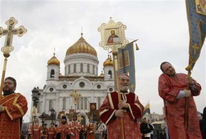 Members of the Orthodox clergy walk in procession after a call to prayer in support of the Orthodox Church at the Christ the Savior Cathedral in Moscow April 22, 2012.