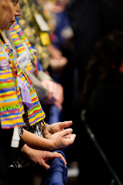 Protesters for greater inclusivity in The United Methodist Church stand in silent vigil just outside the bar of the denomination's 2012 General Conference on May 3, 2012, in Tampa, Fla.