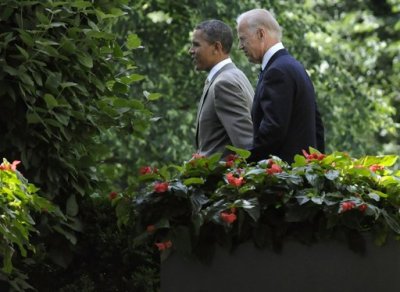 U.S. President Barack Obama (L) and Vice President Joe Biden walk together to a ceremony honoring the 2012 National Association of Police Organizations Top Cops award winners during a ceremony in the Rose Garden at the White House in Washington, May 12, 2012.