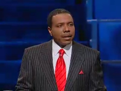Creflo Dollar makes a statement about his arrest and battery charges against his daughter as he stands at the pulpit before his World Changers Church International on June 10, 2012, in Atlanta, Georgia.
