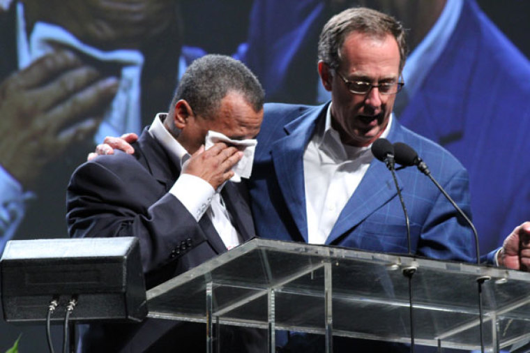 Bryant Wright prays for Fred Luter after his election as the first African-American president of the Southern Baptist Convention, Tuesday, June 19, 2012.