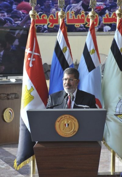 Egypt's new President Mohamed Mursi delivers a speech during a ceremony where the military handed over power to Mursi at a military base in Hikstep, east of Cairo, June 30, 2012. Mursi was sworn in on Saturday as Egypt's first Islamist, civilian and freely elected president, reaping the fruits of last year's revolt against Hosni Mubarak, although the military remains determined to call the shots. The military council that took over after Mubarak's overthrow on February 11, 2011, formally handed power to Mursi later in an elaborate ceremony at the desert army base outside Cairo.