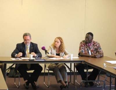 Raymond C. Offenheiser (left), Suzanne Nossel (center) and Bishop Elias Taban discuss the new Arms Trade Treaty at a press briefing at the United Nations on July 3, 2012.