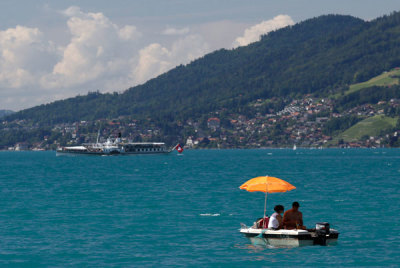A couple is seen on a hot summer day on the Thunersee near Interlaken June 27, 2012.