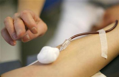 This file photo shows an anonymous person giving a blood donation.