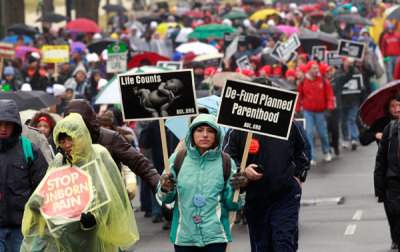 Pro-life demonstrators take part in the 'March for Life' in Washington January 23, 2012. Nearly 100,000 protesters marched to the U.S. Supreme Court to mark the 39th anniversary of the Court's landmark Roe v. Wade decision on abortion.