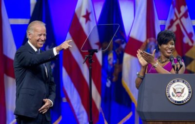 Roslyn M. Brock (R), Chairman of the National Board of Directors of the NAACP applauds as U.S. Vice President Joe Biden is introduced at the their convention in Houston July 12, 2012.