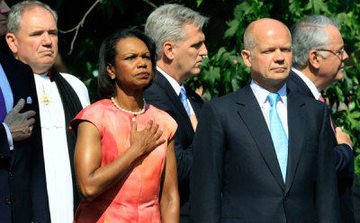 Former U.S. Secretary of State Condoleezza Rice (2nd L) and Britain's Foreign Secretary William Hague (2nd R) listen to the U.S. national anthem at the unveiling of a statue of former President Ronald Reagan outside the U.S. embassy in London July 4, 2011. The 10 foot high statue was commissioned to commemorate Ronald Reagan's achievements and to mark 100 years since his birth.