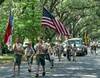 A Boy Scout troop marches at a Fourth of July parade in Magnolia Springs, Alabama in 2011