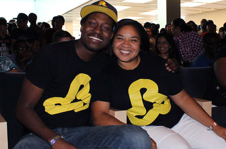 New Yorkers Randy Bazile, 20, and Eboneshia Suggs, 22, arrived early to grab front-row seats for Lecrae's free show at the Apple store in SOHO, NYC July 17, 2012.