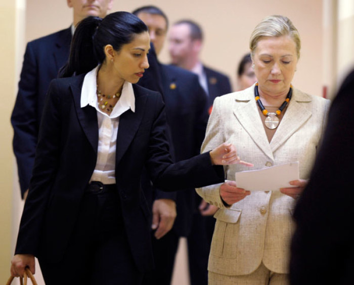 Huma Abedin, aide to U.S. Secretary of State Hillary Clinton, goes over notes with her, during her visit to the newly opened University Teaching Hospital Pediatric Centre of Excellence, in Lusaka June 11, 2011.