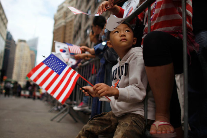 A child attends a Korean parade organized by the Korean American Association to celebrate its 30th anniversary, at Midtown Manhattan in New York October 1, 2011.