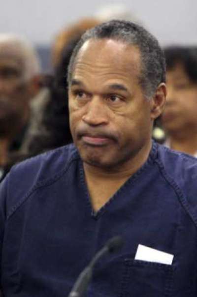 O.J. Simpson listens as District Court Judge Jackie Glass (not in photo) reads his sentence at the Clark County Regional Justice Center in Las Vegas, Nevada in this December 5, 2008 file photograph. Nevada's Supreme Court on October 22, 2010 refused to overturn O.J. Simpson's 2008 robbery conviction for a bungled attempt to recover his own sports memorabilia