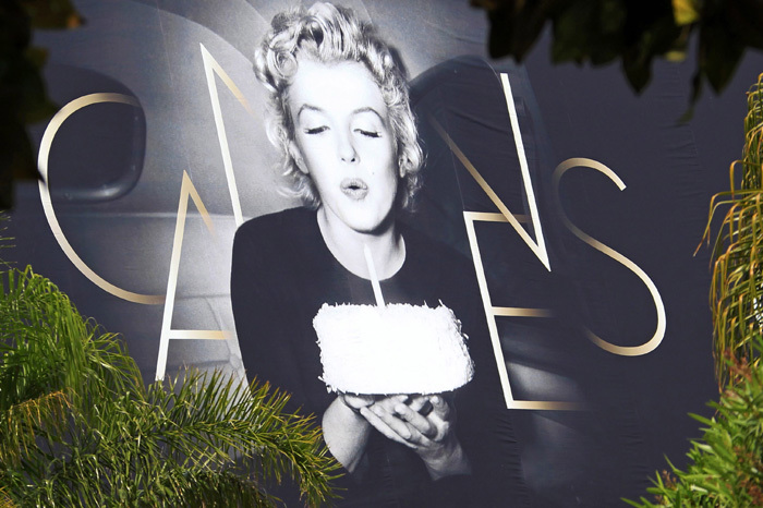 A giant canvas of the official poster of the 65th Cannes Film Festival featuring U.S. actress Marilyn Monroe is seen on the facade of the Festival Palace in Cannes May 15, 2012.
