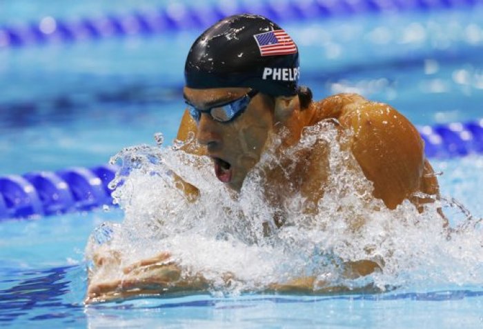 Michael Phelps of the U.S. swims to a fourth place finish in the men's 400m individual medley final during the London 2012 Olympic Games at the Aquatics Centre July 28, 2012.