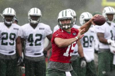 Quarterback Tim Tebow passing during Jets first open training camp practice in Cortland, N.Y., on Saturday, July 28, 2012.