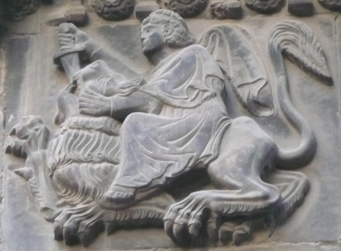 A stone carving at the Catedral de Barcelona depicts a biblical Samson, with long hair, fighting a lion using his superhuman strength. (FILE)