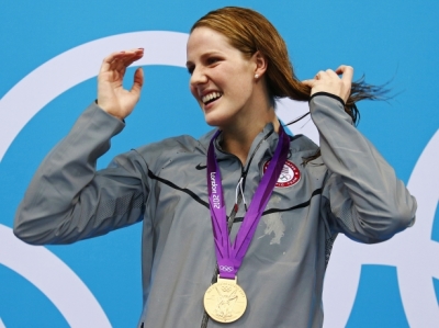 Missy Franklin of the U.S. poses with her gold medal after winning the women's 100m backstroke final at the London 2012 Olympic Games at the Aquatics Center.