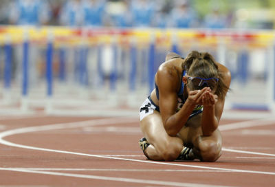Lolo Jones of the U.S. reacts after coming in seventh in the women's 100-meter hurdles final at the Beijing 2008 Olympic Games in the National Stadium Aug. 19, 2008.