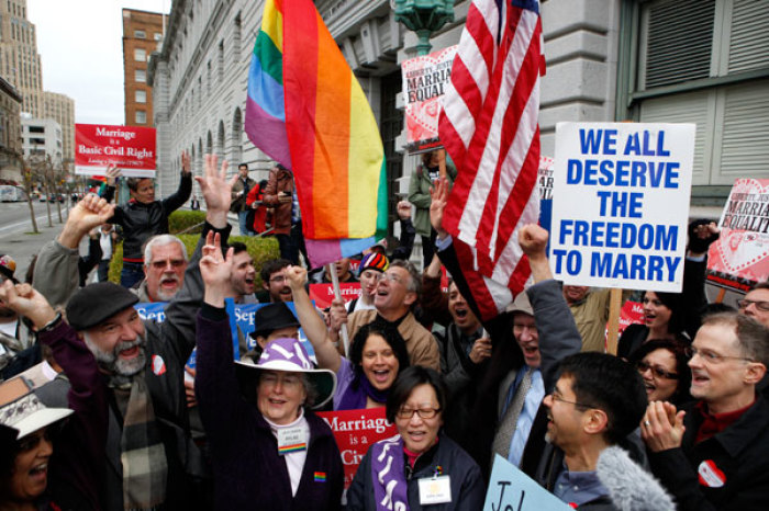 Gay Marriage advocates cheer during a rally moments before hearing the news of the Proposition 8 over-ruling outside the Ninth Circuit Courthouse in San Francisco, California, February 7, 2012.