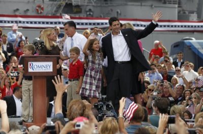 Congressman Paul Ryan (R) waves with his daughter Liza as his wife Janna Little (L) speaks with Republican presidential candidate Mitt Romney after Romney announced Ryan as his vice-presidential running mate during a campaign event at the retired battleship USS Wisconsin in Norfolk, Virginia, August 11, 2012. Sons, Charlie (L) and Sam (C) join Ryan on stage.