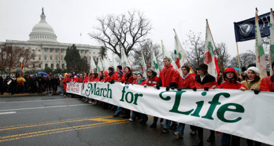 Demonstrators hold a banner during the 'March for Life' as they pass the U.S. Capitol in Washington January 23, 2012. Nearly 100,000 protesters marched to the U.S. Supreme Court to mark the 39th anniversary of the Court's landmark Roe v. Wade decision on abortion.