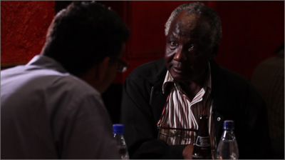 Film co-producer and narrator Dinesh D'Souza interviews Philip Ochieng, who is a lifelong friend of Barack Obama Sr., in Nairobi, Kenya. Movie released August 2012.