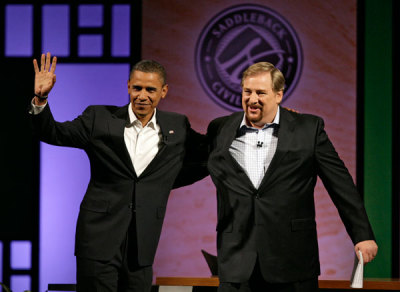 US Democratic presidential candidate Senator Barack Obama (D-IL) (L) is greeted by Pastor Rick Warren at the Civil Forum on the Presidency at Saddleback Church in Lake Forest, California, August 16, 2008.