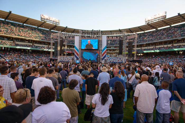 Several thousand people attending Harvest America at Angels Stadium in Anaheim, Calif., made their way down to the ballpark's outfield to make a commitment to Jesus and be led in prayer by Pastor Greg Laurie, Aug. 26, 2012.