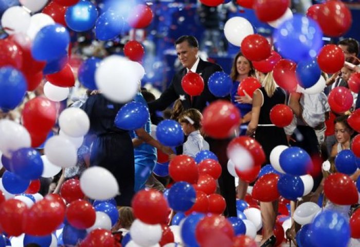 Republican presidential nominee Mitt Romney is seen through the balloon drop at the conclusion of the final session of the Republican National Convention in Tampa, Florida August 30, 2012.